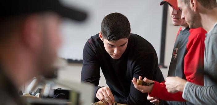 Students choosing rocks in geology class